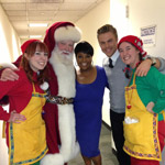 Sherri with Santa and his Elves